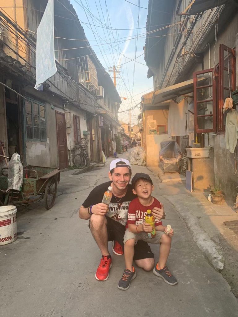 dk on chinese street with host family child